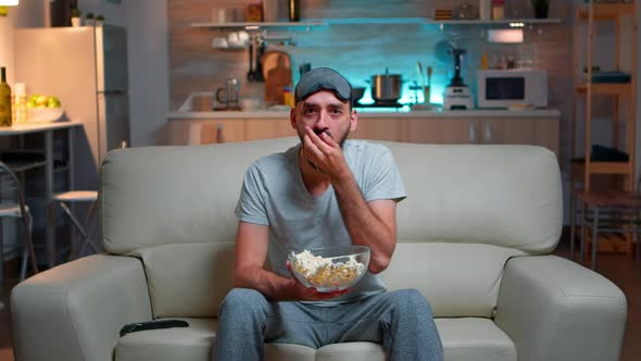 Portrait of Man with Beard Holding Popcorn Bowl