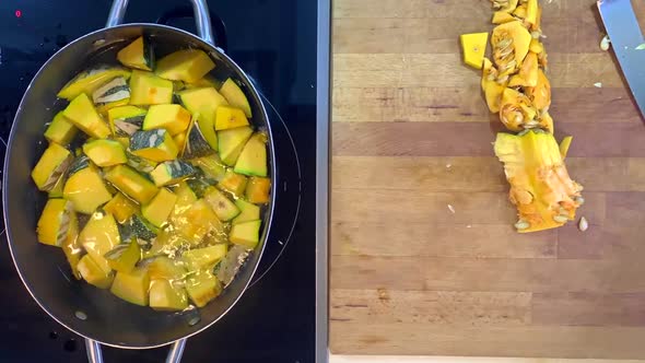 Time-lapse of a pumpkin being cook into a boiling water, sautéed to skillet and place in a glass con