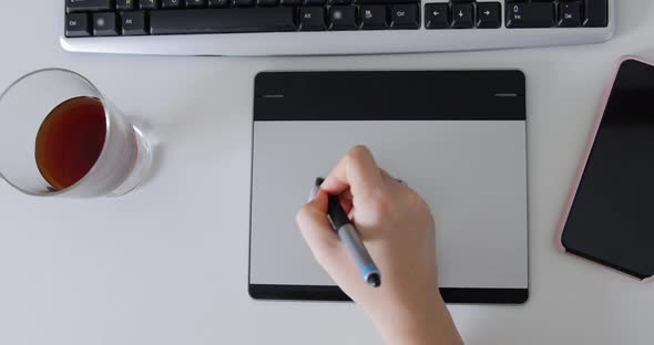 Graphic Designer working with the interactive pen display