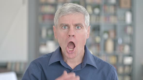 Portrait of Shocked Man Showing Disbelief By Face Expressions