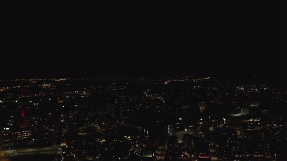 Aerial view of Illuminated city center at night.