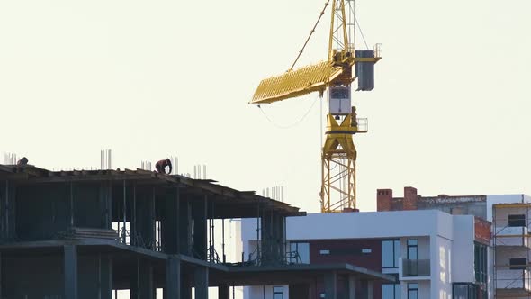 Aerial View of Tower Cranes and High Residential Apartment Buildings Under Construction