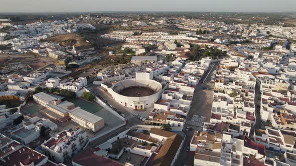 Aerial Orbiting Ayamonte cityscape white houses sprawling, Guadiana river - Huelva