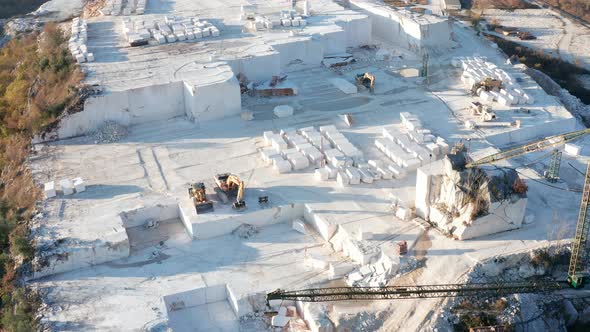 White marble quarry in Carrara - construction rocks mining in an open-pit mine in Tuscany, Italy.