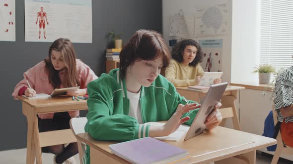 Girl Using Tablet in Class