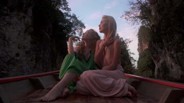 Fit Models Relaxing on Canoe Looking at the View in Cheow Lan Lake