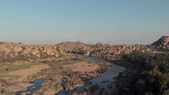 Granite outcrops and rocky landscape alongside the Tungabhadra River in Hampi, Karnataka, India