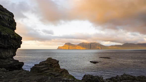 Sunset Over Fjord And Sunlit Mountains