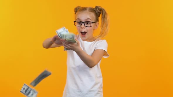 Excited Kid Throwing Money, Celebrating Victory at Talent Show, Jack-Pot Winner