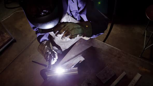 Welder welding a metal