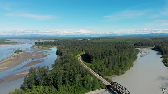 4K Drone Video of Alaska Railroad Train Trestle with Mt. Denali in Distance during Summer