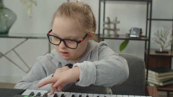 Girl with Disability Learning Musical Gamma Notes