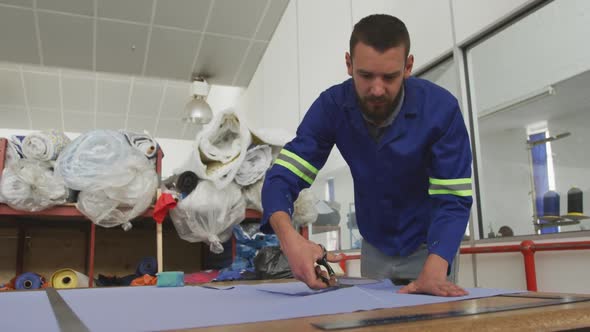 Worker cutting a tissue