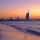 Burj Al Arab in Jumeirah Island or boat building with waves on sea beach, - VideoHive Item for Sale