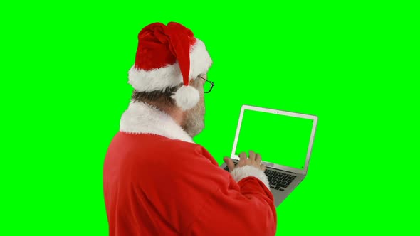 Santa claus using laptop