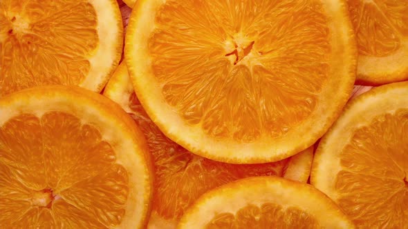 Rotate shot - Background of sliced oranges fruit