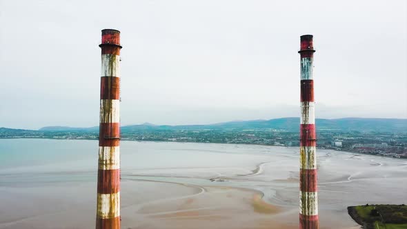 The drone is flying towards the Poolbeg Towers.