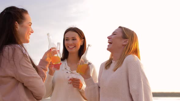 Young Women Toasting Non Alcoholic Drinks on Beach