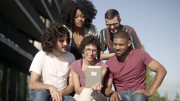 Smiling Friends Having Video Call Through Tablet 