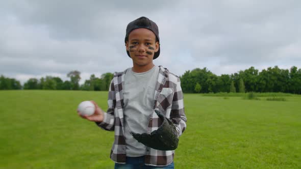 Concentrated Preadolescent Boy Baseball Player Ready for Pitch in Field