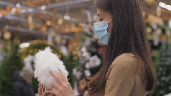 Young Woman Disposable Mask Holds Fluffy Owl Effigy