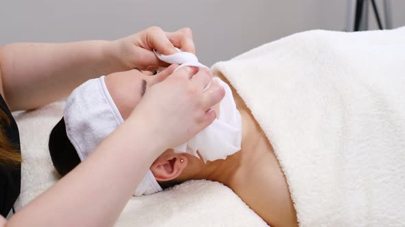 Young Woman Lying on a Stretcher in an Aesthetic Center Performing Beauty Treatment and Facial