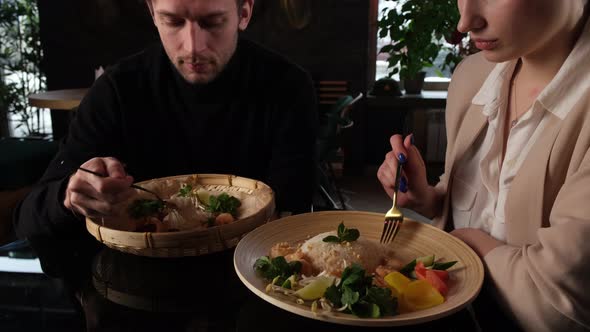 Boy and Girl Eating Asian Food