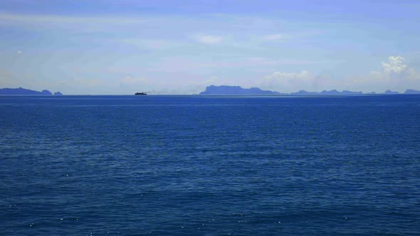 Looking at the sea, island and sky from the sea. (Slow motion - Angle 008)