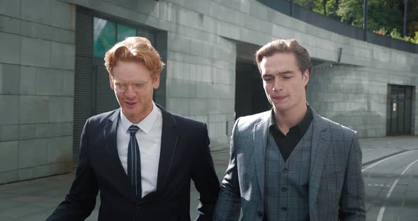 Two Partners Businessmen Talking and Walking Outside Office Building Two Employees Coworkers Manager