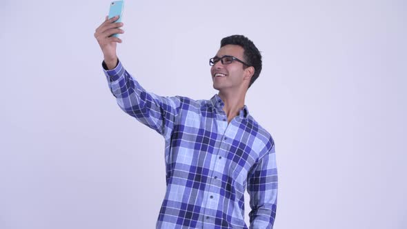 Happy Young Indian Hipster Man Taking Selfie