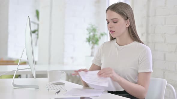Disappointed Young Woman Trying To Write on Paper 