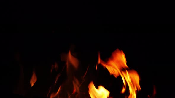 flames from camp fire burning at night