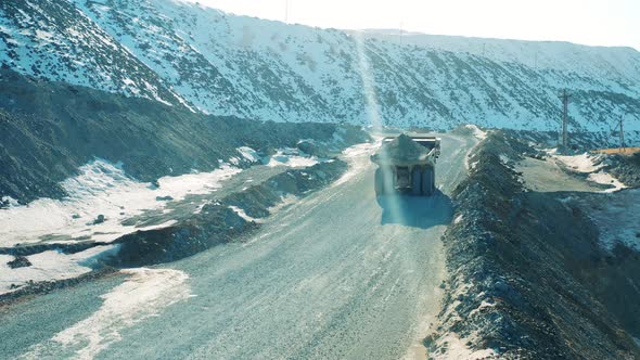 Industrial Machine is Transporting Ore Through the Opencut Mine