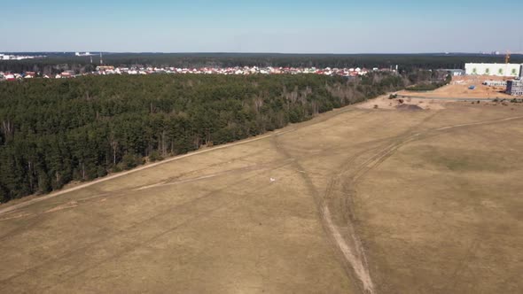 Aerial Footage of a Small Model Aircraft Flying in the Air