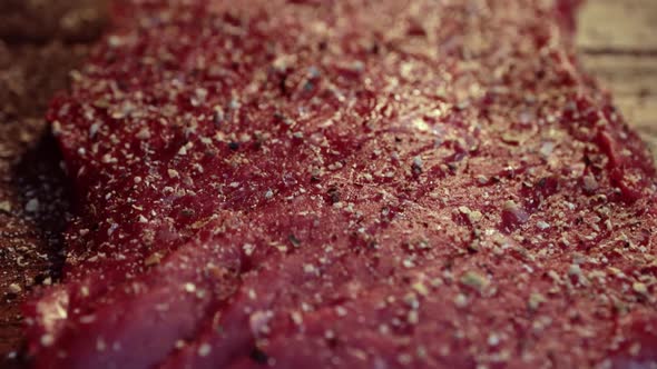 Mixed Pepper and Spices on the Raw Meat Steak