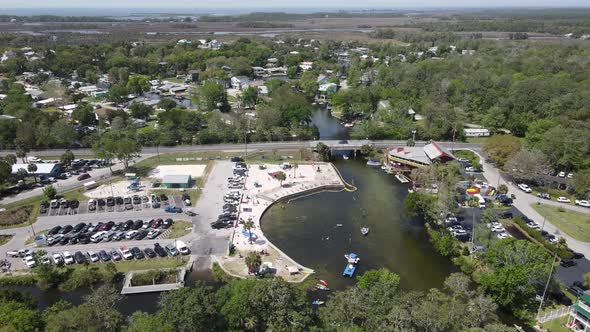 perfect aerial of the gulf coast in the distance and Roger's Park in Weeki Wachee, Florida.  Old Flo