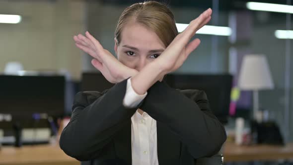 Portrait of Young Businesswoman Saying No By Hand Gesture 