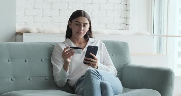 Caucasian Young Woman Using Credit Card for Mobile App Online Shopping
