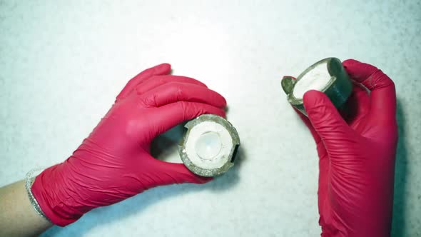 Technician opens the box and looks at artificial eye.