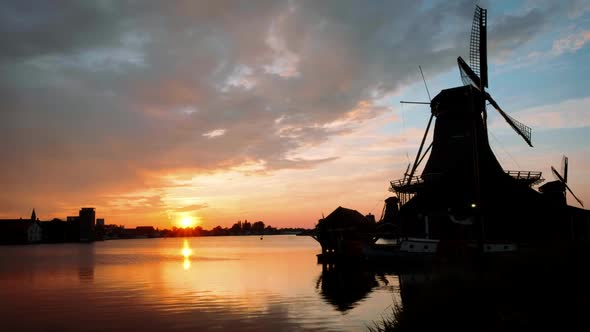 Windmills at Zaanse Schans in Holland on Sunset. Zaandam, Nether