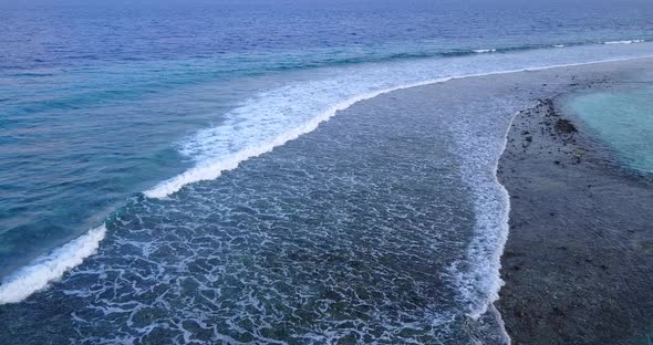 Beautiful aerial abstract shot of a white paradise beach and aqua blue water background in hi res 4K