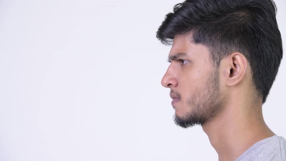 Profile View of Young Angry Bearded Indian Man Screaming