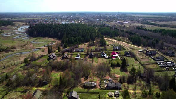 Village Houses Near the Forest and the River Taken From a Drone