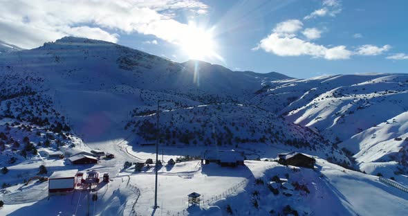 Ski Center Mountains And Sun Aerial View