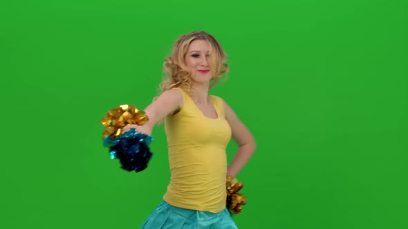 The Cheerleader Vigorously Moves Her Hips Arms Whirls Does Vertical Splits and Waves Her Hair