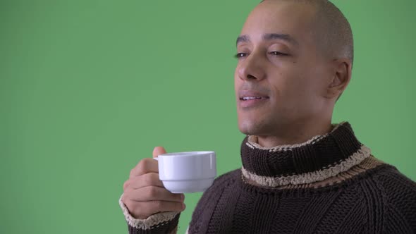 Face of Happy Bald Multi Ethnic Man Drinking Coffee Ready for Winter