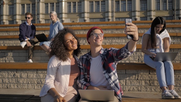 Group of students in front of university taking selfie