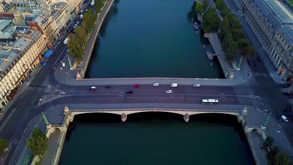 Drone camera tilt view from Pont du Carrousel bridge to west. View of Tuileries Garden, Place de la