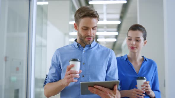 Creative People Using Tablet During Coffee Break