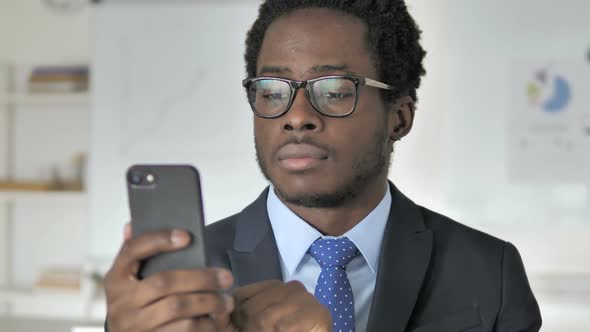 African Businessman Using Smartphone